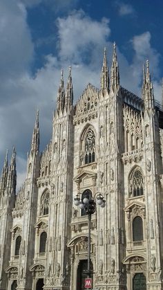 the large cathedral has many windows and spires