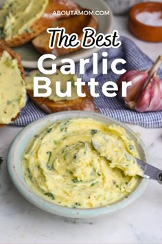 garlic butter in a bowl with bread and garlic on the side