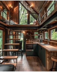 the interior of a tiny cabin with wood floors and wooden walls, windows, and tables