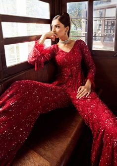 Elevate your style with our sequoia sharara set in maroon, featuring intricate braided thread work and hand-sewn detailing with sequins and cutdana. This ensemble is a true masterpiece of craftsmanship, adding a touch of timeless elegance to your look. Sequined Semi-stitched Palazzo Set For Festivals, Red Sequined Sets For Navratri, Party Wear Semi-stitched Sharara With Sequins, Festive Sequin Palazzo Set For Festivals, Festive Anarkali Palazzo Set With Sequins, Bollywood Style Sequined Palazzo Set For Eid, Red Bollywood Pant Set For Festive Season, Bollywood Style Festive Red Pant Set, Bollywood Style Sequined Palazzo Set