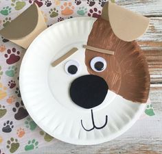 a paper plate with a dog's face on it