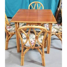 a table and chairs made out of rattan