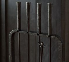 an iron gate with four bars on it