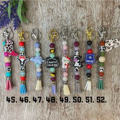 several key chains with different designs on them