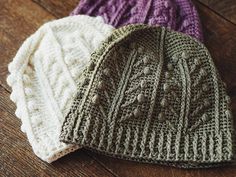 a white knitted hat with the words poshmark on it and an image of a