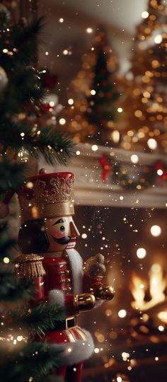 a nutcracker ornament sitting next to a christmas tree with lights in the background