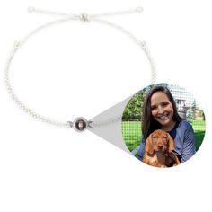 a photo of a woman holding a dog on a white string bracelet with a brown bead