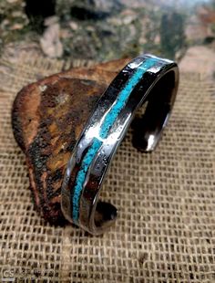 "* Turquoise Stainless Cuff Bracelet. * Heavier Version . 3.75 X 13.5 mm Thick and Wide. * Turquoise Inlay. * Textured Sand Dust on face. * Measure your whole wrist size with tight and mark it on the option. Do not add or less on actual measure. It can not be resizing and so not returnable. * Wrist size 6\" - 6.5\" has 1 \" gap 6.75- 7.5\" has 1.2\" gap 7.75- 8.5\" has 1.5\" gap. If you want special size gap, please leave it on the note." Southwestern Polished Cuff Bracelet As Gift, Turquoise Cuff Bracelet With Polished Finish, Turquoise Bracelet With Polished Finish As Gift, Turquoise Bracelets With Polished Finish As A Gift, Turquoise Bracelets With Polished Finish For Gift, Gift Turquoise Bracelet With Polished Finish, Adjustable Turquoise Cuff Bracelet With Polished Finish, Adjustable Turquoise Polished Cuff Bracelet, Absolutely Fabulous