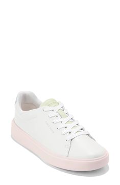 This sleek leather sneaker with clean lines inspired by classic tennis styles has rubber caps at the toe and heel for added traction. Round toe Lace-up style Removable cushioned footbed Leather upper/textile lining/synthetic and rubber sole Imported White Low-top Platform Sneakers With Rubber Heel Cap, Sporty Low-top Platform Sneakers With Rubber Toe Cap, Sporty White Platform Sneakers With Rubber Heel Cap, Everyday Sneakers With Rubber Toe Cap, White Lace-up Platform Sneakers With Rubber Heel Cap, Modern Low-top Sneakers With Rubber Toe Cap, White Heather, Up Styles, Cole Haan