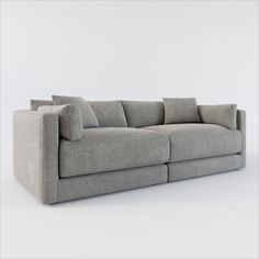 a gray couch sitting on top of a white floor