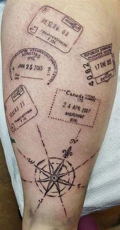 a man's arm with a map tattoo on it and some other things around him