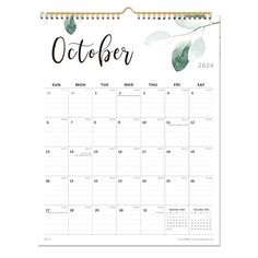 a calendar with the word october on it and watercolor leaves in front of it