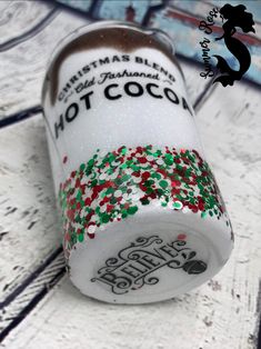 a can of hot cocoa with christmas sprinkles on it