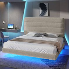 a bedroom with a bed, desk and chair in the room that has blue lighting