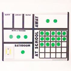 a bathroom wall calendar with green dots on it