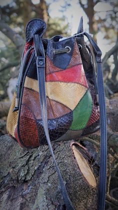 "Vintage Snake Patchwork colorful crossbody bag Really nice and in good condition (only one stain), with some signs of use but good. Vintage Snake leather from 60s. Made in Argentina Measures: - Tall: (25 cm) 9.84\" - W: (27 cm) 10.62\" - Deep: (8 cm) 3.14\"\" - Handles: 36.61\" (93 cm) Thanks for stopping by!!" Multicolor Satchel Bucket Bag, Multicolor Leather Crossbody Bucket Bag, Multicolor Leather Satchel Bucket Bag, Retro Multicolor Shoulder Bag With Adjustable Strap, Multicolor Retro Satchel With Adjustable Strap, Retro Multicolor Satchel With Adjustable Strap, Multicolor Leather Bucket Bag, Vintage Multicolor Shoulder Bag For Travel, Vintage Multicolor Bags For Daily Use