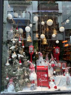 a store window with christmas decorations in it