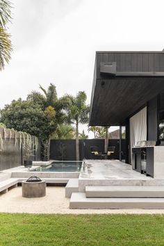 an outdoor living area with concrete steps and grass