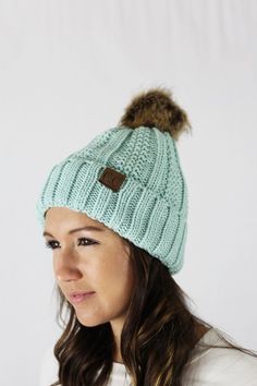 Our bestselling winter hats in a different knit style, with faux fur pom Lined in micro-plush 100% Acrylic Casual Winter Beanie With Pom Poms, Cold Weather Beanie With Pom Poms, Casual Winter Hats With Pom Poms, Casual Beanie With Pom Poms, Casual Pom Pom Hat For Cold Weather, Knit Style, Fur Pom Pom, Indiana, Rib Knit