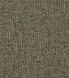 an upholstered fabric textured with small squares