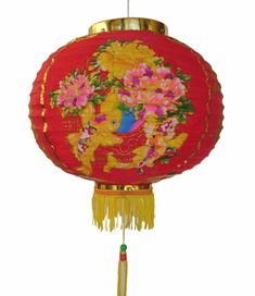 a red and yellow chinese lantern with flowers on the front, hanging from a gold chain