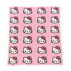 a pink towel with hello kitty faces on it