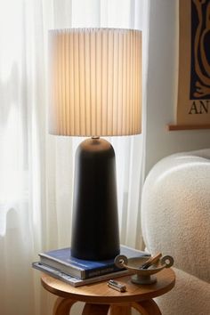 a lamp on a table next to a chair