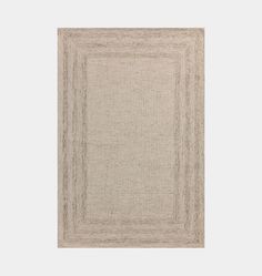 a beige area rug with lines in the middle and a square shape on top of it