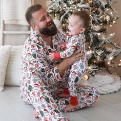 Perfect for snuggling up by the fire with a warm cup of cocoa, this adult pajama set is sprinkled with the sweetest Christmas cookies to bring some festive fun to your holiday season! This long sleeve pajama set with a button-up design fits both men and women, and has a classy collar to elevate your family matching look to make for the perfect Christmas card photo. Made from soft bamboo, these pajamas will keep you cozy throughout every winter wonderland, and were made for family matching fun. Whether you're watching your little ones open presents on Christmas morning or chestnuts roast by the open fire, these cookie PJs are the secret ingredient you've been looking for for a magical holiday season! Adult Pajama Set Details: 95% Bamboo Viscose | 5% Spandex Extra length & pockets for comfor Two Piece Pajama Set, Cup Of Cocoa, Personalized Swaddle, Girls Nightgown, Newborn Accessories, Personalized Sweater, Hooded Bath Towels, Adult Pajamas, Open Fire