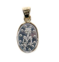 A hand-made piece of jewelry that honors Our Lady of the Miraculous Medal Classic, sturdy, and evocative Mexican medal Genuine silver from Mexico and a 14k solid gold bezel. The elegance of the medal is enhanced by the two-tone metals The medal is a work of art and unique, but it's appealing to everyone One of the devotional medals that are worn the most often across the country is the Our Lady of the Miraculous Medal. The narrative of the medal's inception begins in Paris, France, where three a Symbolic White Gold Cross Pendant Jewelry, Symbolic Yellow Gold Oval Pendant Jewelry, Spiritual Engraved White Gold Jewelry, Engraved Spiritual White Gold Jewelry, Engraved White Gold Spiritual Jewelry, Spiritual White Gold Oval Pendant Jewelry, Symbolic Hallmarked Cross Jewelry, 14k Gold Medallion For Commemoration, Memorial Medallion Jewelry With Charms