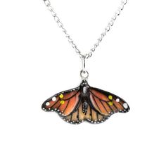 Handcrafted porcelain. Hand-painted with very fine detail. The pendant is about .75" long. 24" silver-plated chain. Critter Tailz Fun Fact: The brightly-colored Monarch Butterfly is the only butterfly that makes lengthy migrations both north and south like birds do. CAUTION! NOT A TOY. Decorative Item Only. WARNING! CHOKING HAZARD. Not for children under 3 years. Not intended for consumption or use in a stove, microwave, or dishwasher. FEATURES: 1: MINIATURE IN SIZE: Approximately 1.5 " x 1.7" or 3.8 cm x 4.5 cm (height and length varies by animal) 2: CRAFTSMANSHIP: Little Critterz figurines are carefully handmade by our artisans. First, artist-carvers study, form and mold each animal to recreate it realistically. Next, we select and mix the best porcelain we can find, and finally, using s Butterfly Monarch, Jewelry Butterfly, Porcelain Animal, North And South, Porcelain Jewelry, Handcrafted Necklace, Monarch Butterfly, Butterfly Pendant, Animal Jewelry