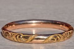 Art Nouveau Bracelet, W.M.C., Wolcott Manufacturing Bangle.  This gold filled bangle measures 8.4mm in width and is signed WMC.  The bangle fits up to a 6.75 inch wrist and features fine piercing and engraving throughout.   Love this piece, but don't have the money to spend right now?  We offer FREE layaway on every item in our shop.  With just 20% down, take one full year (interest-free) to pay off your new jewelry!  There are no hidden fees or charges, ever.  For more information on our layawa Anniversary Etched Gold Bangle Bracelet, Victorian Bangle Bracelet For Anniversary, Etched Bangle Bracelets For Wedding, Engraved Rose Gold Bangle Bracelet, Anniversary Bangle Bracelet With Decorative Band, Wedding Jewelry Bangle With Decorative Band, Anniversary Jewelry Bangle With Decorative Band, Yellow Gold Bangle Bracelet With Decorative Band, Rose Gold Engraved Bangle For Wedding