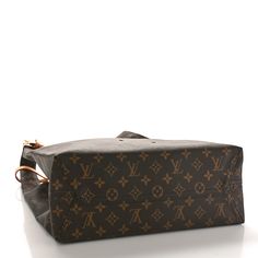 This is an authentic LOUIS VUITTON Monogram Atlantis GM. This chic shopping bag shape is crafted of monogram-coated canvas. It features top handles that can be belted together, a vachetta name tag, and polished brass hardware. The top is open to a beige interior . Louis Vuitton Monogram Bag, Beige Interior, Louis Vuitton Empreinte, Louis Vuitton Vernis, Heart Chain, Monogram Bag, Louis Vuitton Shoulder Bag, Name Tag, Chain Bags