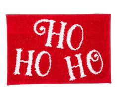 a red door mat with the words ho ho written in white on it, against a white background