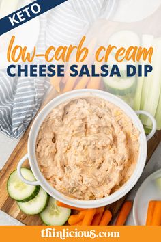 low carb cream cheese salsa dip in a white bowl surrounded by cucumbers and carrots