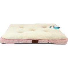 the pink dog bed is made out of plush material