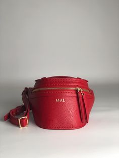 Women's fanny pack handmade from natural materials for connoisseurs of handmade, quality and exclusive things. This simple leather cross body bag has everything you need and more, whether you're shopping, cycling or traveling. Beloved for its versatility and stylish looks, this belt bag holds everything you need and more. Fashionable leather belt bag in a minimalist style in thick red leather Material: Italian textured leather Leather Color: red Fittings: High quality Italian fittings Furniture color: colors gold Zipper sk Italy - colors gold Overall size: width 15,7" - 40 сm height 6,7" - 17 сm thickness 5,1" - 13 сm Strap size: width 0,9" - 2,5 сm length 43,3" - 110 сm Handle size: width 0,7" - 2 сm length 4,7" - 12 сm -------------------------------------------------- ------------------ Leather Bum Bag, Fanny Pack Women, Womens Sling Bag, Girlfriend Anniversary Gifts, Birthday Gift For Girlfriend, Girlfriend Anniversary, Leather Cross Body Bag, Leather Fanny Pack, Simple Leather