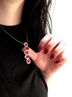 "This necklace uses stacked rocks as an inspiration for its rounded, organic forms. The pendent is handmade using solid sterling silver and enamel and is 2\" tall, hangs from a modern 16\", 18\", or 20\" nylon coated stainless steel cord with a sterling spring ring clasp. Model photo shows a different color option and is for size reference only. This listing is for the light blues version. You can see the matching earrings here: https://www.etsy.com/listing/266025576/pebble-earrings-in-shades-of Modern Nickel-free Teardrop Pendant Jewelry, Red Enamel Jewelry With Large Pendant, Minimalist Silver Enamel Jewelry, Modern Nickel-free Enamel Jewelry, Modern Silver Enamel Necklace, Enamel Large Pendant Jewelry, Enamel Oval Pendant Jewelry, Enamel Oval Pendant Jewelry With Large Pendant, Enamel Jewelry With Large Oval Pendant