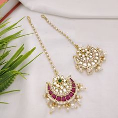 "Sabyasachi Pacchi Kundan Mang Tika /Kundan Mang Tika / Rajwadi Bollywood Mang Tika / Bridal Mang Tika/Ruby Emerald Mang Tika /Punjabi Tikka Made in Brass with Kundan, Pearls and Emerald/Ruby stones Lightweight Jewelry Pendant: 1.5\" Total Length: 5\" Mang Tika comes with Hook to attach to hair Suitable for any traditional attire/ Occasion Made with very high quality pearls" Maang Tika Design, Luxury Festive Tikka For Diwali, Mang Tika Designs, Kundan Mang Tika, Pearl Mang Tika, Luxury Gold Tikka With Stone Work, Luxury Elegant Tikka With Stone Work, Luxury Traditional Wedding Tikka, Luxury Kundan Tikka With Cutdana