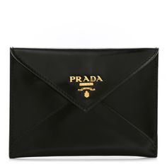 This is an authenticPRADA Saffiano Metal Envelope Compact Wallet in Black. This is a chic clutch wallet that is finely crafted of cross-grain textured saffiano leather in black.  The front flap unsnaps to a leather interior to store bills and acheckbook. Designer Envelope Pouch For Everyday Use, Formal Clutch Pouch With Card Slots, Elegant Envelope Bag With Interior Card Slots, Modern Envelope Wallets For Evening, Luxury Envelope Clutch For Formal Occasions, Luxury Envelope Clutch With Magnetic Closure, Chic Envelope Wallet With Removable Pouch, Elegant Envelope Wallet With Magnetic Closure, Luxury Envelope Pouch