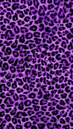 a pink and black animal print fabric with lots of small spots on it's surface