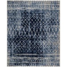 a blue and white rug with an abstract design