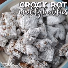 a bowl full of crock pot muddy buddies with the words crock pot muddy buddies above it