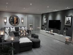 a living room filled with furniture and candles