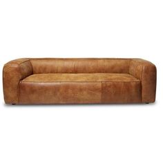 a brown leather couch sitting on top of a white floor