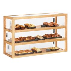 three tiered display case filled with baked goods