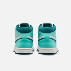 Style No. DZ3745-300 Color: Bleached Turquoise/Barely Green/Sail/Sky J Teal Dope sneakers count as self-care. And with colors inspired by the aisles of your neighborhood beauty supply store (plus cloud-like Nike Air cushioning underfoot), these mid-top J's will have you feeling anything but mid. Go ahead—treat yourself. Two sets of laces lets you switch it up. Patent leather toe overlays and textile underlays create a mixed-media effect. Nike Air-Sole unit in the heel delivers signature cushioni Wmns Air Jordan 1, Air Jordans Women, Air Jordan 1 Mid Se, Beauty Supply Store, Marina Blue, Jordans Women, University Blue, Air Jordan 1 Mid, Air Jordan 1 Retro