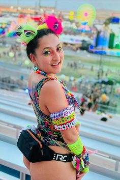 🌈👑 Shine bright and light up the night with this neon rave look! Featuring bold colors, playful accessories, and a fun fanny pack, this outfit is perfect for dancing from dusk till dawn. Embrace the festival vibes and let your style sparkle! 🎶✨ #RaveOutfit #FestivalFashion #RaveGirl #MusicFestivalOutfit #FreedomRaveWear #NeonVibes #FestivalStyle Multicolor Bodysuit For Summer Music Festival, Rave Multicolor Bodysuit For Club, Rave Style Multicolor Bodysuit For Club, Rave Bodysuit For Music Festival, Rave Stretch Swimwear For Music Festival, Rave Style Swimwear For Music Festivals, Rave Bodysuit For Music Festival With Stretch, Rave Stretch Bodysuit For Music Festival, Playful Summer Party Bodysuit