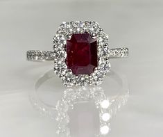 an oval shaped ruby and diamond ring