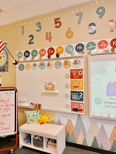 a child's room with a whiteboard and lots of numbers on the wall